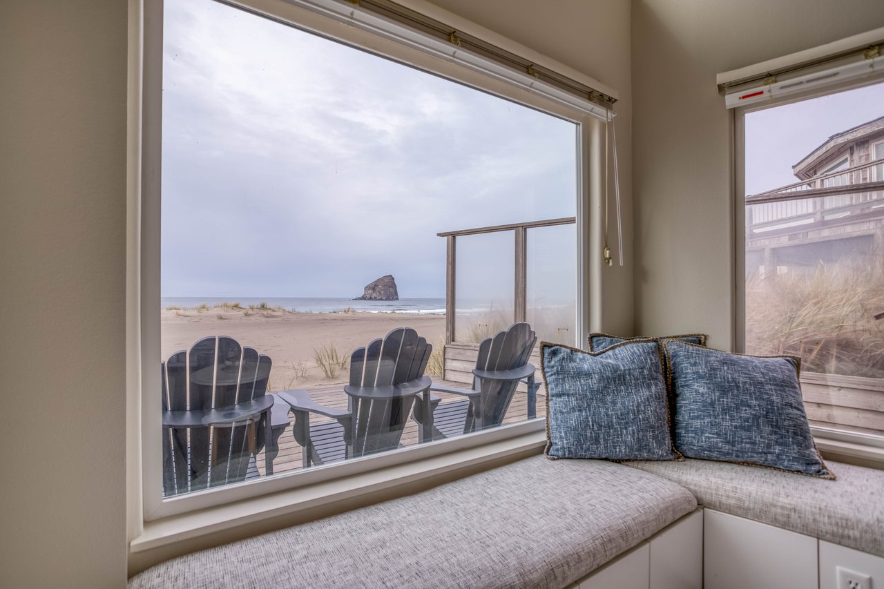 View of the sea , beach and rock from inside the property